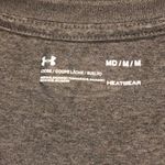 Under Armour  v-neck short sleeved women’s shirt size medium Photo 3