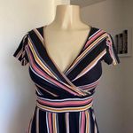 Cute black, pink, and yellow striped faux wrap dress. Black Photo 1