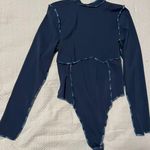 Out From Under Bodysuit Photo 0