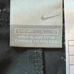 Nike  Womens Athletic Pants Size L Black Zip Pockets Zip Away Hem Mid Rise Photo 1