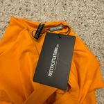 Pretty Little Thing Orange Bow Front Cutout Swimsuit Photo 1