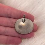 Antiqued silver tone pendant with oval shaped variegated brown stone Photo 3
