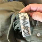 Khaki green jumpsuit with button Photo 2