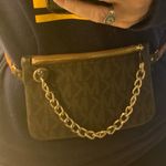 Michael Kors Brown & Bronze Monogram PVC Belt Bag. Photo 1