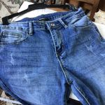 Women’s Medium Wash MidRise Slight Distress Babybell Jeans sz small Blue Photo 7