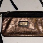 GiGi HILL BRONZE COLORED CROSSBODY OR WRISTLET
HAS BOTH STRAPS
VEGAN LEATHER Brown Photo 0