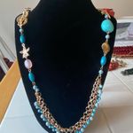 Gold toned necklace with teal beads and starfish, shell and seahorse cha… Blue Photo 1