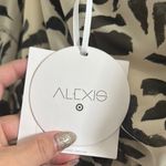 Alexis Elegant Black and White Leaf Print Dress Photo 6