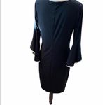 Nik And Nash  Size Medium Black With White Trim Trumpet Sleeve Dress. Photo 2