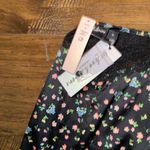 For Love & Lemons NWT  x VS
COLLECTION LUCY BLACK FLORAL SKIRT SIZE SMALL Photo 3
