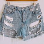 We The Free Free People |  Distressed Button Fly Denim Shorts. Size 30. Photo 0