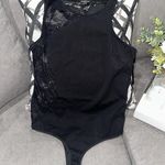 Bebe Black lace bodysuit with cut-out detail size L Photo 0