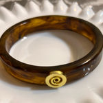 Tortoise Brown Bracelet with Gold Spiral detail
Classic minimalist accessory Photo 0