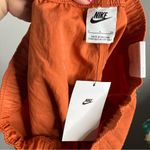 Nike  loose fit high rise cargo shorts orange rust women’s size small new‎ casual Photo 9
