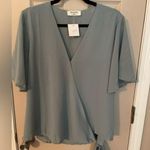 Zenana Outfitters Wrap Front, Side Tie Blouse.​ Photo 0