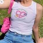 Harry Styles old lover’s baby tank Photo 0