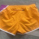 Nike Dri-Fit Size Medium Orange and Purple Running Athletic Shorts. Photo 5