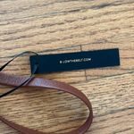 B-low the Belt  brown belt Photo 1