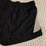 Nike  womens dri fit black and white running shorts size S Photo 1