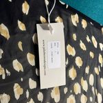 Julie Brown One-shoulder dress with a golden and black abstract print. Lightweight, flowy, Photo 1