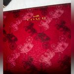 Coach  Corner Zip Wristlet in the color 1941 Red with Horse and Carriage print. Photo 2