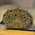 Gold and Red Ornate Clutch with Gemstone Embellishments Photo 2