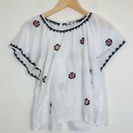 Madewell slightly sheer white cotton top w/ black, red & yellow embroidery. S Photo 3