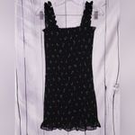 Aritzia Wilfred Luella smocked mini dress in a black with green leaf print Photo 1