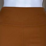 We Wore What ‎ Nylon Biker Short in Gold Photo 2