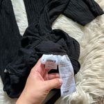 Reformation  Adrian Ribbed Jumpsuit In Black Photo 7