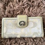 Coach  Silver/Gray and tan signature Turnlock wallet with purple lining Photo 10