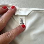 H&M Short Sleeve Ivory White Thong Bodysuit w/ Gold Button Detail Women's Medium Photo 2