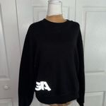 I am gia  NWOT TAJA BLACK CREWNECK SIZE SMALL Photo 1