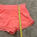 Athleta neon coral orange High Rise Mesh Racer Run 3" shorts size M Photo 6