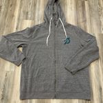 Peloton Gender neutral, full zip sweatshirt with an exaggerated hood, front hand pockets, and rib detail  at sleeve cuffs and bottom band Garment dyed for a worn in feel 100% cotton  logo at left chest  Studios logo at center back Made in the USA No size tag pit to pit measurement is 26,length is 30 Photo 4