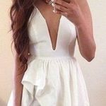 San Joy  Deep V Neck Low Cut Asymmetrical Ruffle Romper Dress in white Photo 0