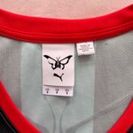 Puma  X Dua Lipa Black and Blue Striped Crop Top with Red Accents Jersey Photo 1