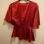 Bishop and Young  Satin Front Twist Karlie Top Red Cheetah Print Photo 1