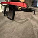 Gucci GG1714S cat-eye sunglasses with a black frame and solid grey lenses Photo 14