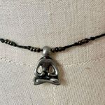 Silver tone yoga choker pendant necklace on cord Photo 0