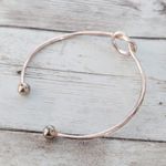 Very Light Shade of Rose Gold Tone Knot Bracelet Photo 7
