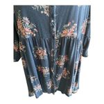 Torrid -BLUE BABYDOLL TOP-WOMENS SIZE 1X Blue babydoll top with pink flowers, 3/4 sleeves, button front, lots of stretch, 95% rayon and 5% spandex, great condition Measurements: Bust: armpit to armpit 24 inches  Length: shoulder seam to bottom  Front: 30 inches  Back:  33 inches  Photo 2