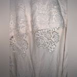 Blush Noir : Asymmetrical Hem Creme Tunic with Delicate Lace details. Photo 1