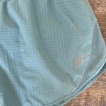 New Balance  blue lined shorts size small Photo 1