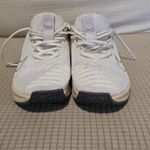 Nike White and Gold Athletic Sneakers Photo 1