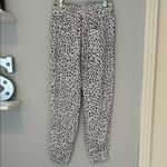 Olivaceous Black and White Leopard Print Joggers Photo 1