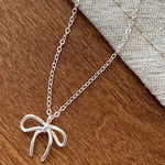 Dainty Bow Necklace Silver Photo 0