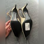 Dolce & Gabbana
Logo-embellished raffia slingback pumps Photo 11