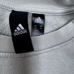 Adidas Women’s Medium  sweatshirt. Light green/gray. Striped sleeves. Photo 3