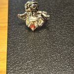Beautiful ring it has a red colored heart stone in the middle. Size 6 angel. Photo 3